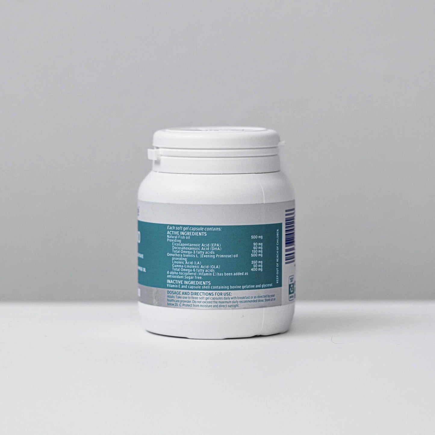 White bottle of Omega-3+6 Combo 1000mg capsules with detailed supplement facts label against a plain gray background