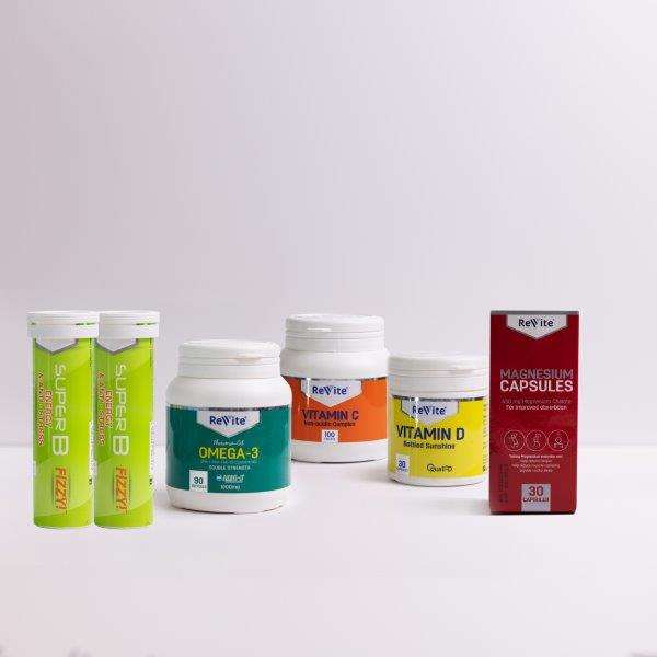 Speciality Box Workaholic vitamins and supplements including Vitamin C, Omega-3, Vitamin D, Magnesium Capsules, and Super B fizzy tablets