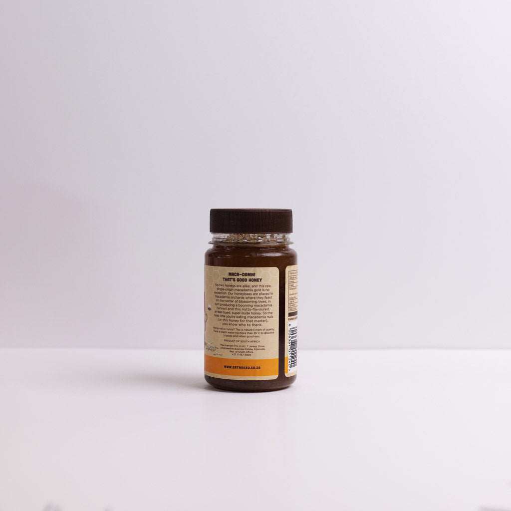 Macadamia Blossom Raw Honey jar 325g with amber nutty-flavored honey