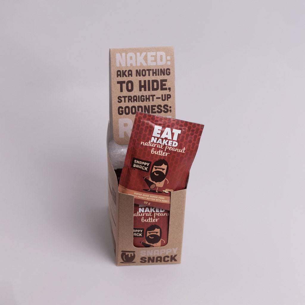 Natural peanut butter sachets box with individual red packets of natural peanut butter snack