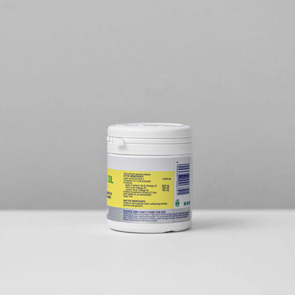 Container of Omega 3 6 and 9 Flax Seed Oil supplement capsules on plain background