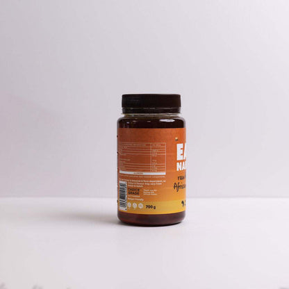 700g jar of Raw Honey African Blend with natural enzymes and pollen visible