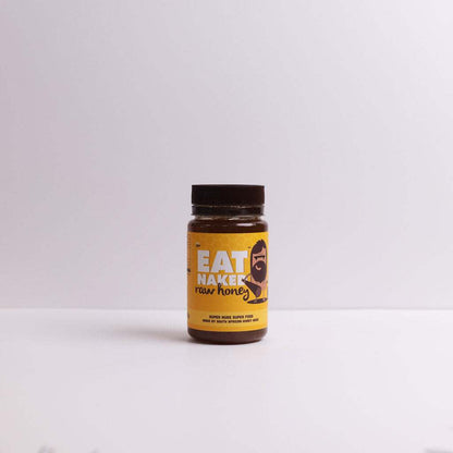 Raw Honey Jar 325g with natural enzymes and pollen in a clear plastic container with a yellow label and black lid on a plain white surface